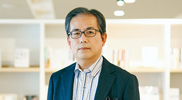 Photo : President and Representative Director Atsuo Kawamura